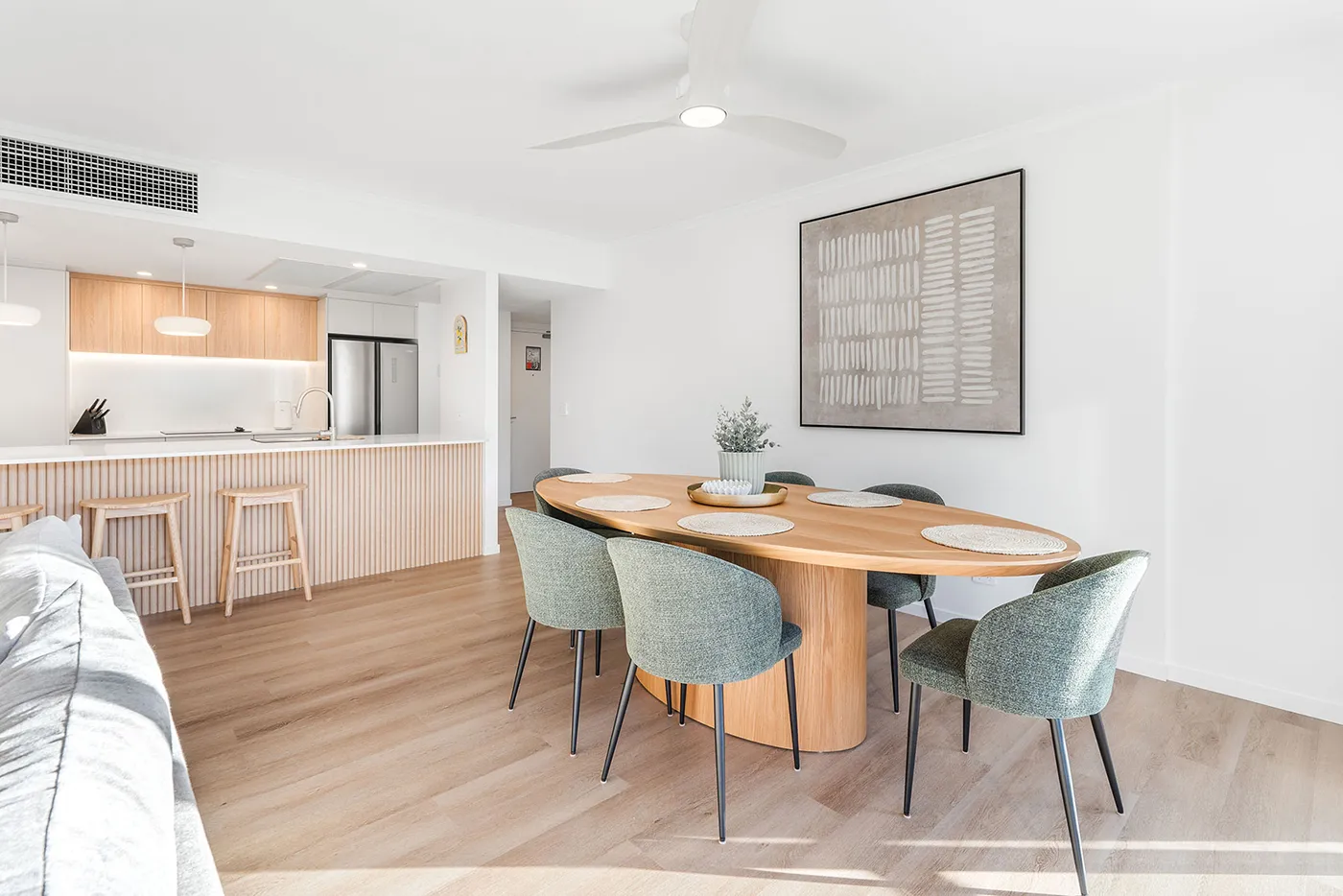 Light-filled dining and living area in the Swell Resort apartment, Burleigh Heads